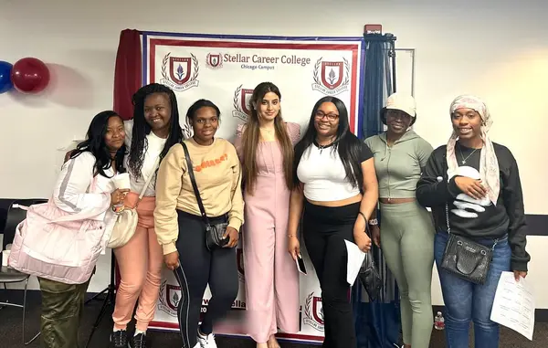 Alina Asif with a group of new students at a meet and greet, Stellar Career College Chicago campus