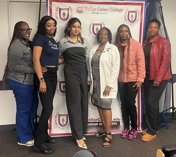 Alina Asif with a group of new students at a meet and greet, Stellar Career College Chicago campus
