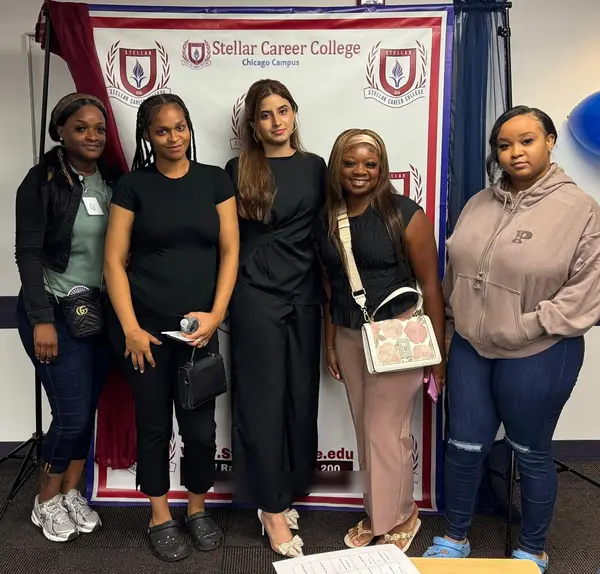 Alina Asif with four new students at a meet and greet, Stellar Career College Chicago campus